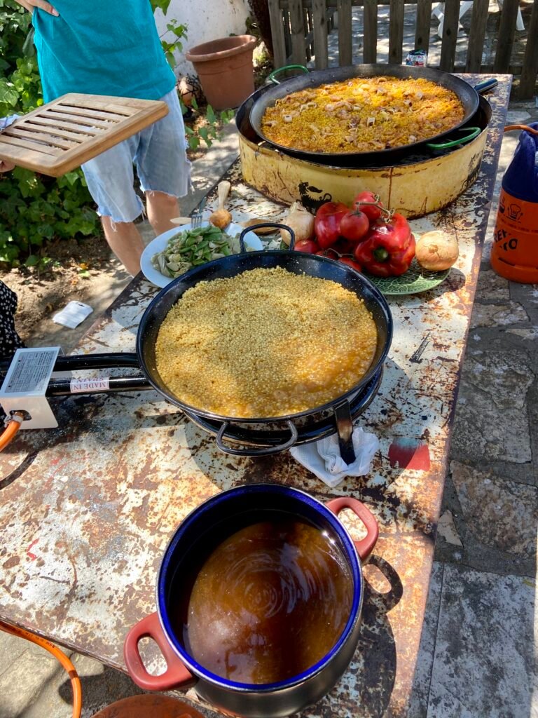 Two different Paellas being cooked with the Paellita method